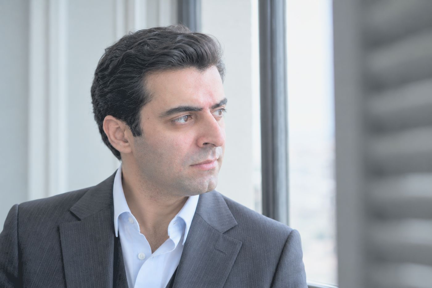 Kave Asad, founder of EDON, by an office window